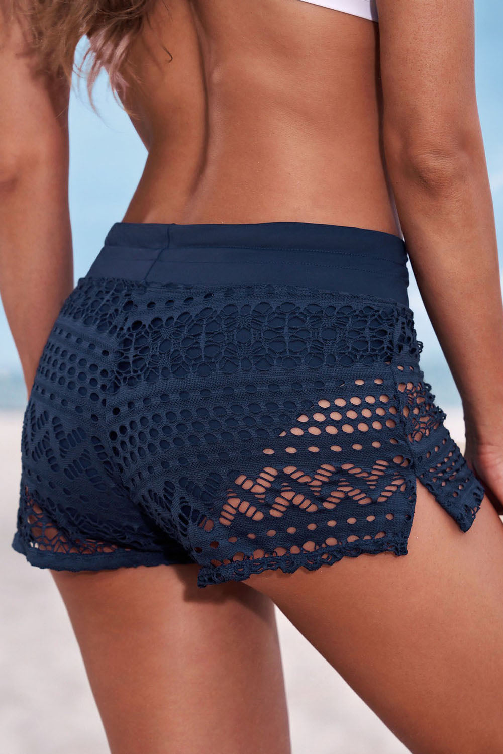 Full size drawstring waist swim shorts with solid pattern and openwork lace design.