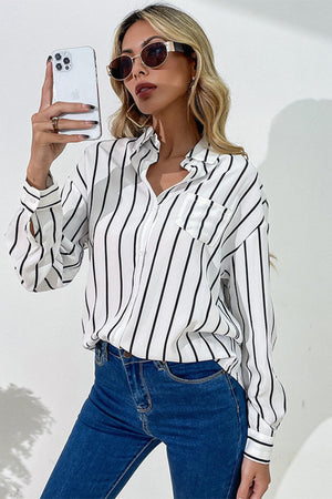 Vertical stripes button down shirt with turn-down collar and asymmetrical hem, styled on a woman wearing sunglasses.