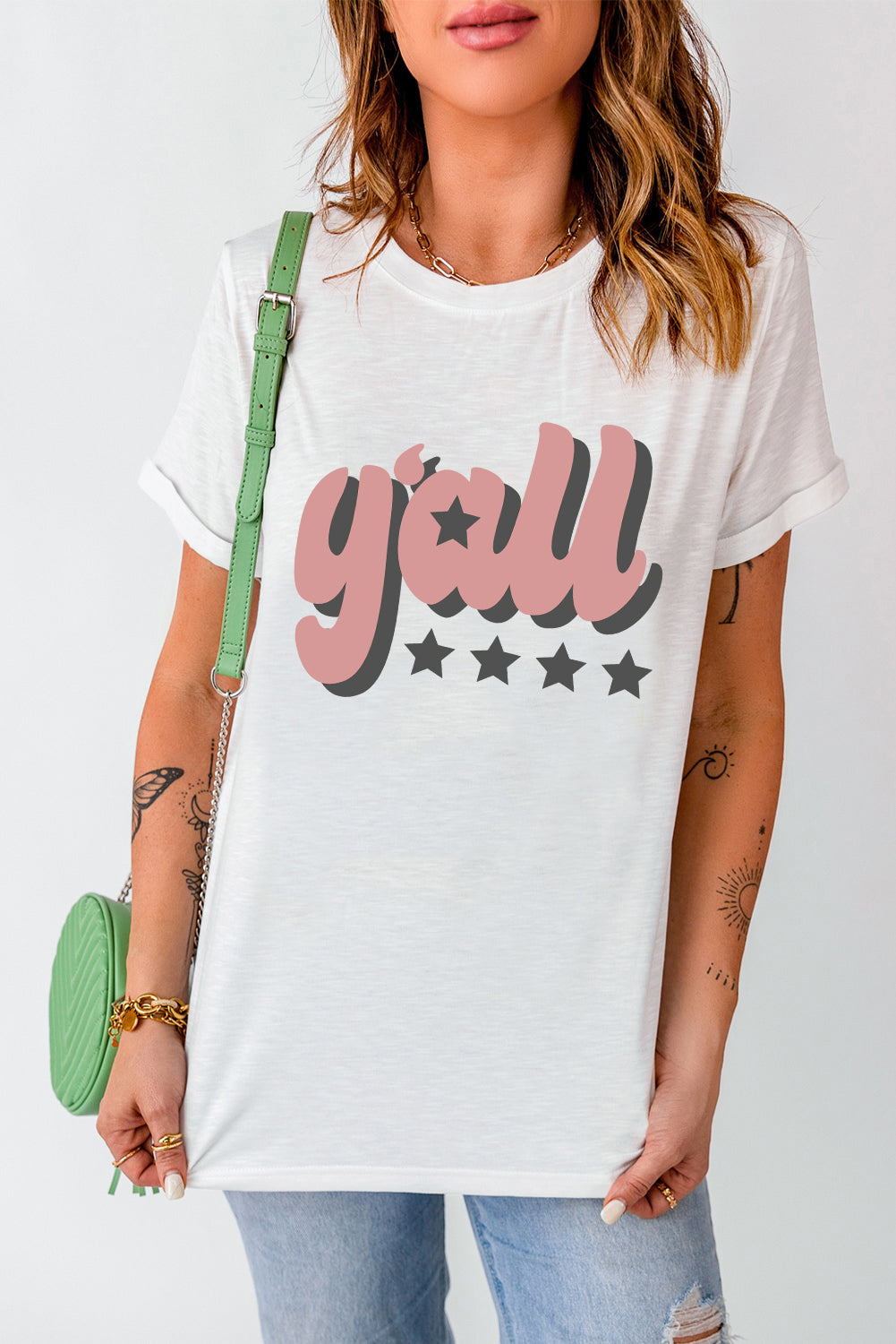 Y'ALL graphic round neck tee with short sleeves in white, styled casually.