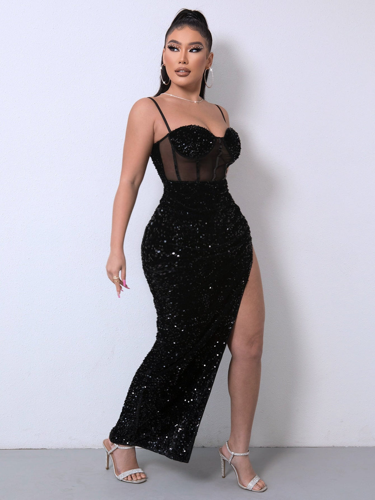 Sequin spliced mesh adjustable strap dress with sweetheart neckline and maxi length.