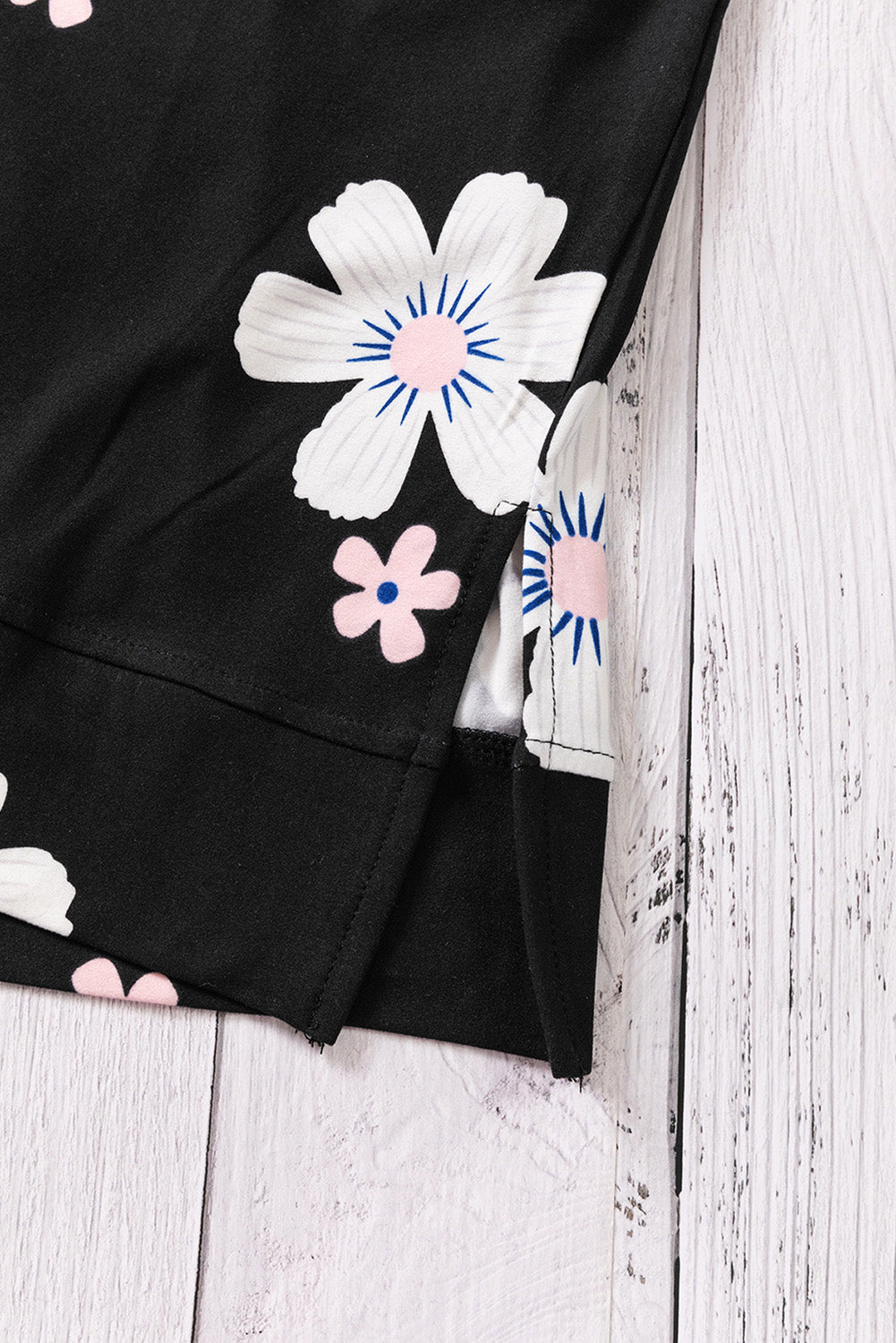 Printed side slit round neck tank with floral design.