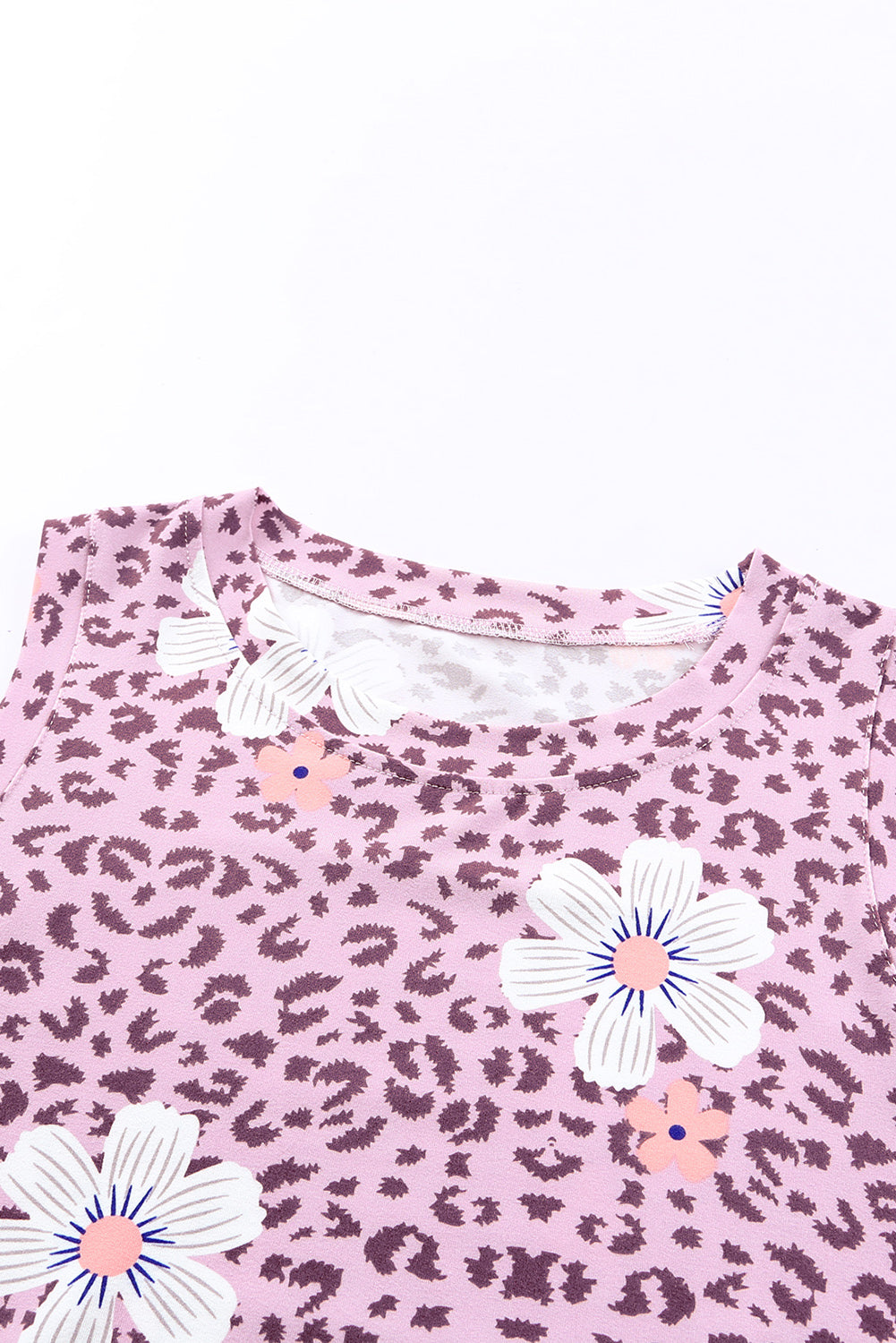 Printed side slit round neck tank with floral pattern and animal print.
