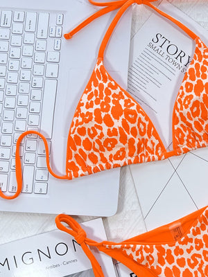 Leopard print halter neck tie side bikini set with removable padding.
