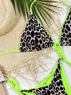 Leopard print halter neck tie side bikini set with neon green accents.