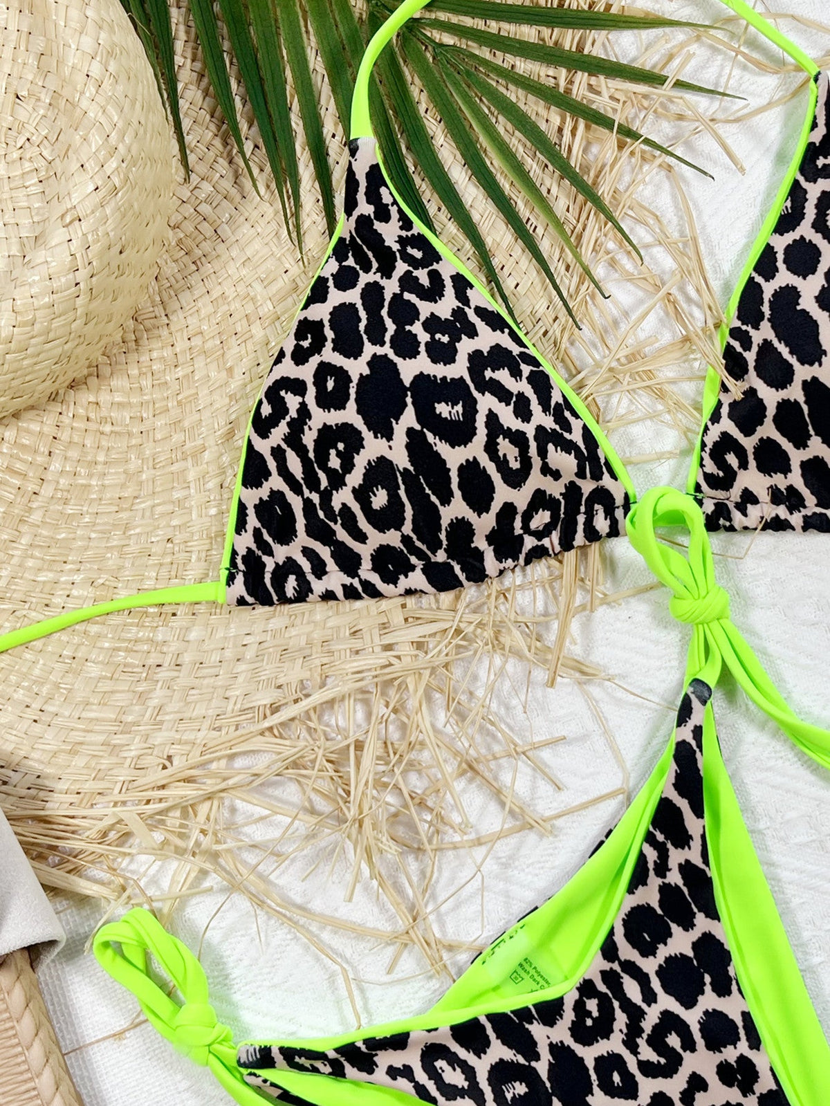 Leopard print halter neck tie side bikini set with neon green accents.